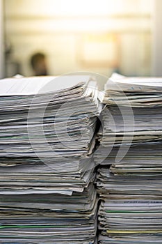 Stacks of paper files work desk office, business report papers,piles of unfinished documents achieves