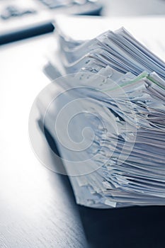 Stacks of paper on the office table