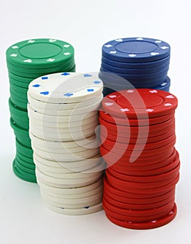 Stacks of poker chips green, red, white, blue