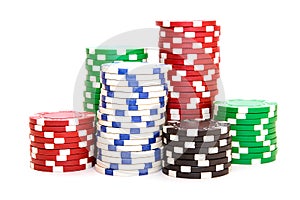 Stacks of poker chips including red, black, white and green
