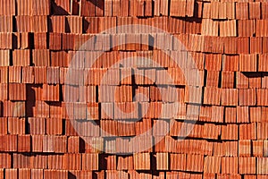 Stacks of red bricks as background