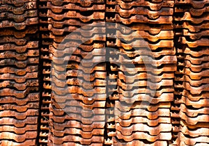 Stacks of red clay roof tiles