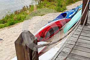 Stacks Of Rental Boats Canoes Wait On The Beach