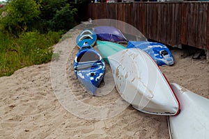 Stacks Of Rental Boats Canoes Wait On The Beach