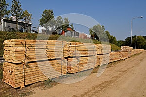 Stacks of rough cut dimensional lumber