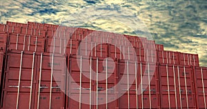 Stacks of shipping containers under evening cloudscape