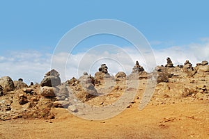 Stacks of stones on sand desert