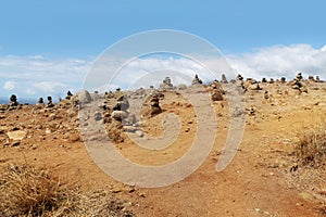 Stacks of stones on sand desert