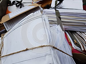 Stacks of tied waste paper for disposal.