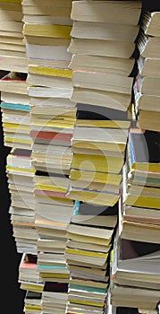 Stacks of Used Paperback Books