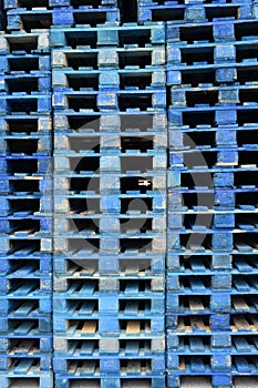 Stacks of wooden cargo shipping pallets.