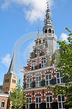 The Stadhuis Town Hall with the clock tower of Martinikerk St Martin church in the background,  Franeker