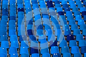 Stadium of dark blue seats abstract background