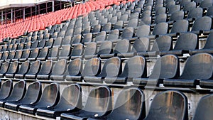Stadium, empty plastic seats in the stadium before a game or during the COVID-19 coronavirus pandemic. Lots of empty