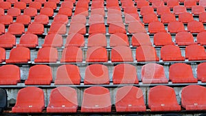 Stadium, empty plastic seats in the stadium before a game or during the COVID-19 coronavirus pandemic. Lots of empty