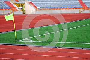 STADIUM - Football field with goal and tablo on blue sky