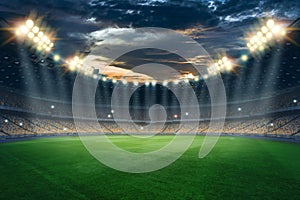 Stadium in the lights and flashes, football field. Concept sports background, football, night stadium. Mixed media, copy space