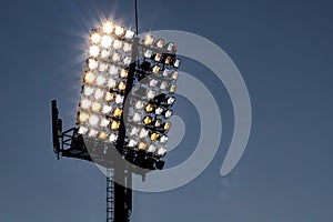 stadium lights reflector and dark blue sky