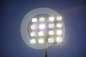 Stadium lights tower on sky background