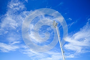 Stadium lights under blue sky