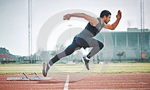 Stadium, man running and athlete on a runner and arena track for sprint race training. Fast, run and sports exercise of