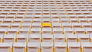 Stadium seat rows in sports arena for football or soccer game, public theatre, concert hall amphitheater with white yellow empty