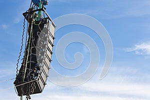 Stadium speakers rack over a blue sky. Live music background