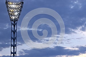Stadium sportlight against evening blue sky