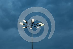 The Stadium Spot-light tower over Blue Sky at night time