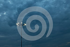 The Stadium Spot-light tower over Blue Sky at night time