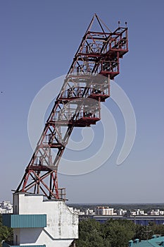 Stadium spotlight , a lighting mast with spotlights at a sports stadium against a blue sky