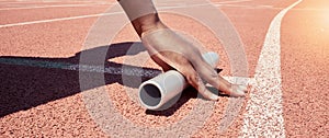 Stadium start track, athlete hands and relay ready for runner competition, sports race and fitness exercise. Marathon