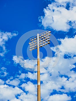 Stadium Tower Lights, Blue Sky and White Clouds