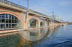 A Stadtbahn viaduct with incoming train, tourist boat and the Tr