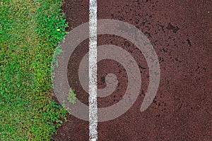 Staduim track, abstract white line with grass on red background