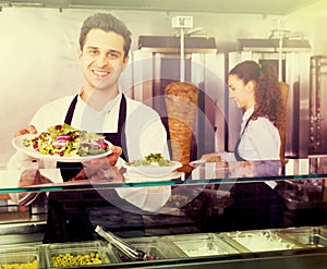 Staff posing at kebab counter