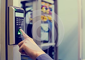 Staff push down electronic control machine with finger scan to access the door of control room or data center. The concept of data