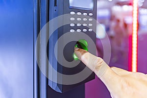 Staff push down electronic control machine with finger scan to access the door of or data center. The concept of data security or