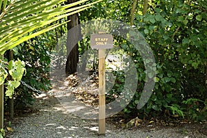 Staff only sign on forest path