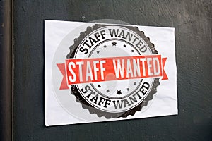 A staff wanted sign poster, advertising for work, London UK.