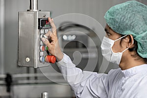 Staff workers working operate control machine in hygiene food factory