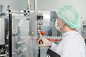 Staff workers working operate control machine in hygiene food factory