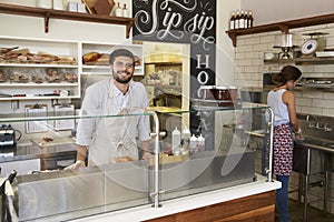 Staff working behind the counter at a sandwich bar