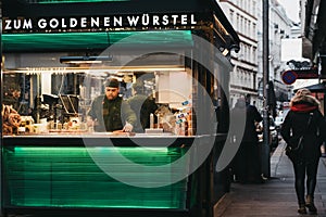 Staff working at the Zum Goldenen Wursten `The Golden Sausages` stand in Vienna, Austria.