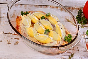 Staffed jumbo shells pasta in glass baking pan