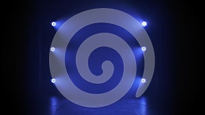 Stage blue floodlights flashing during a live show concert, in a night club or party. Dark background. Studio spotlight