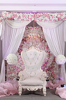 Stage decoration with pink and white plastic flowers
