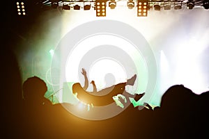 Stage diving. Crowd surfing during a musical performance