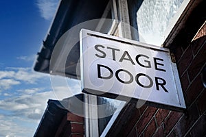 Stage door sign above entrance to theatre