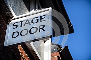 Stage door sign over performers` entrance at theatre